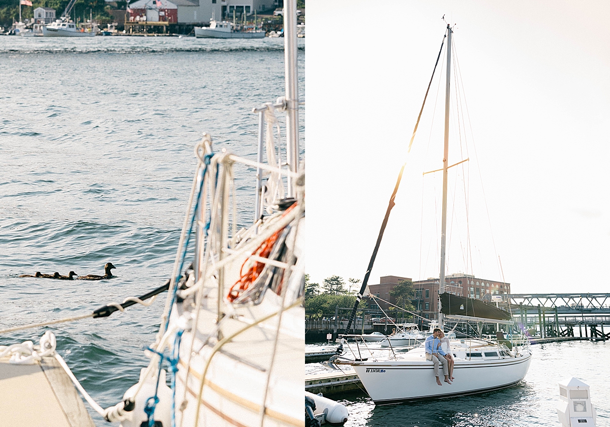 Ducks swim beside a sailboat on calm harbor water; nearby, a couple sits barefoot on a white sailboat docked at the marina.