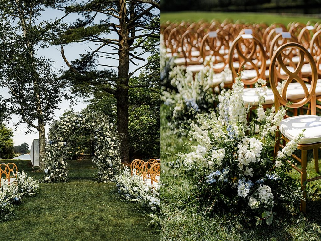 Outdoor ceremony setup with wooden chairs and white floral arrangements overlooking the water at Inn at Diamond Cove in Maine.