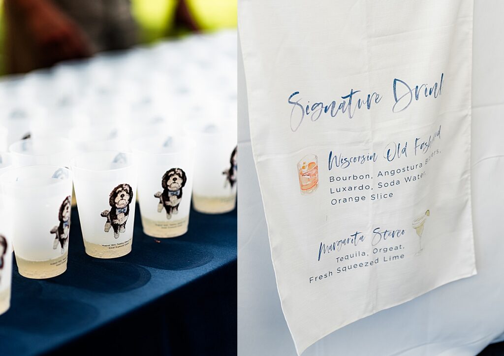 Signature cocktail display with illustrated cups and printed drink menu at an outdoor wedding reception.