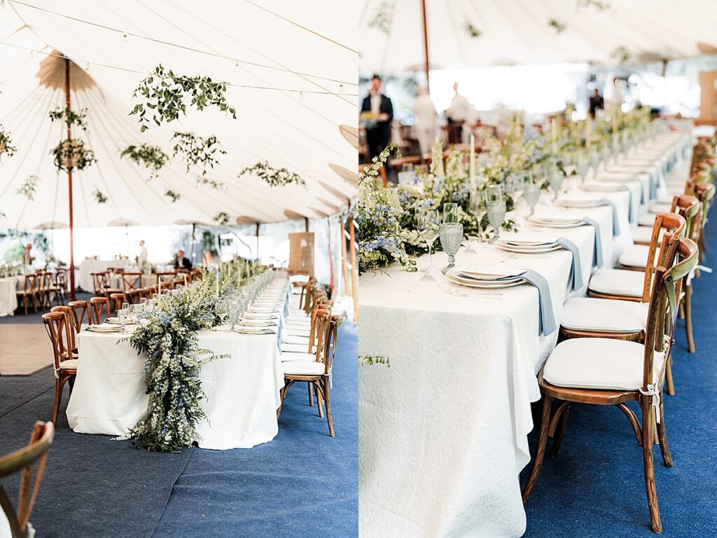Long reception tables with white linens, blue runners, and floral centerpieces inside a sailcloth tent.