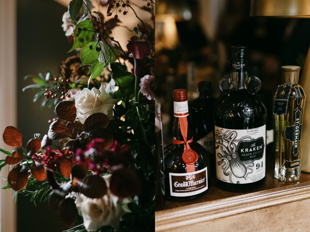 Left: Moody floral arrangement with deep red and white blooms and greenery. Right: Bar setup with liquor bottles including rum and liqueur on a wooden surface.