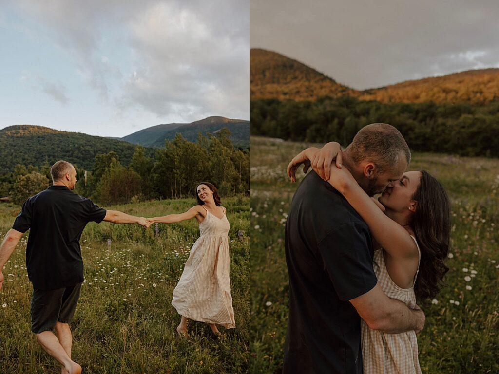 Couple holding hands while walking through a wildflower meadow and embracing during golden hour with New Hampshire mountains behind them.