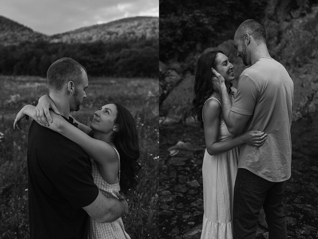 Black and white portraits of a couple embracing in a mountain meadow and standing together in a shallow stream during a New Hampshire engagement session.