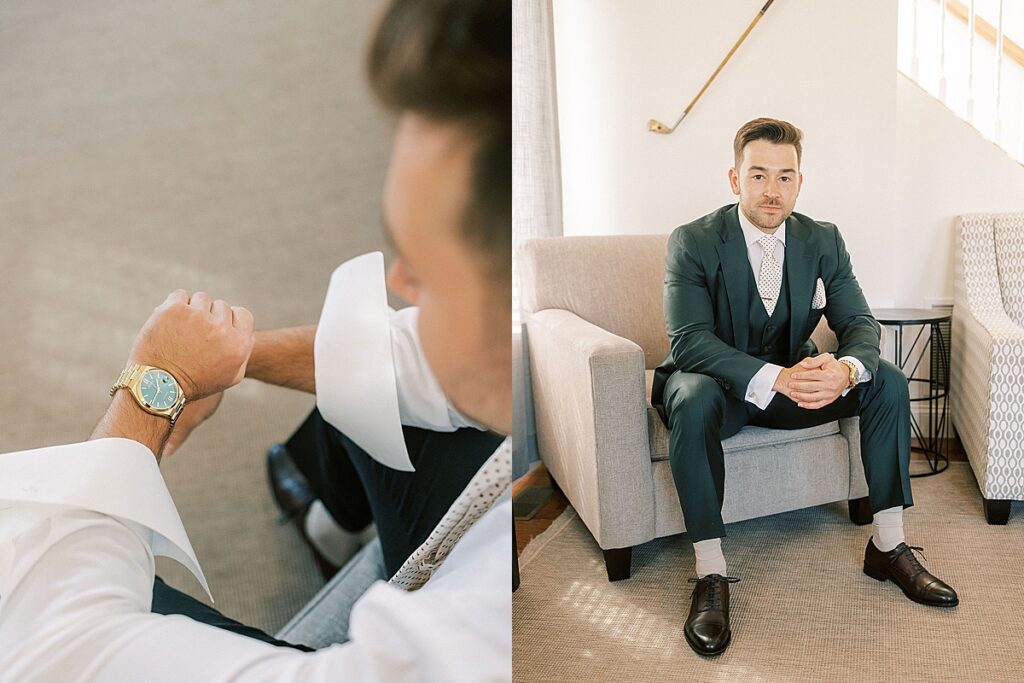 Groom checking his watch and sitting in chair wearing green suit and tie during wedding day preparations.