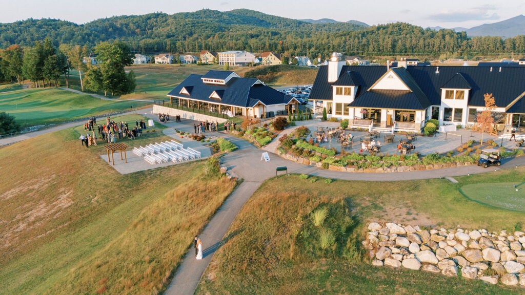 Aerial view of the ceremony lawn and clubhouse during cocktail hour at Owl’s Nest Resort.