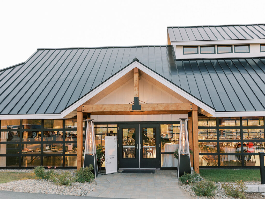 Exterior of the reception building at Owl’s Nest Resort glowing in warm evening light.