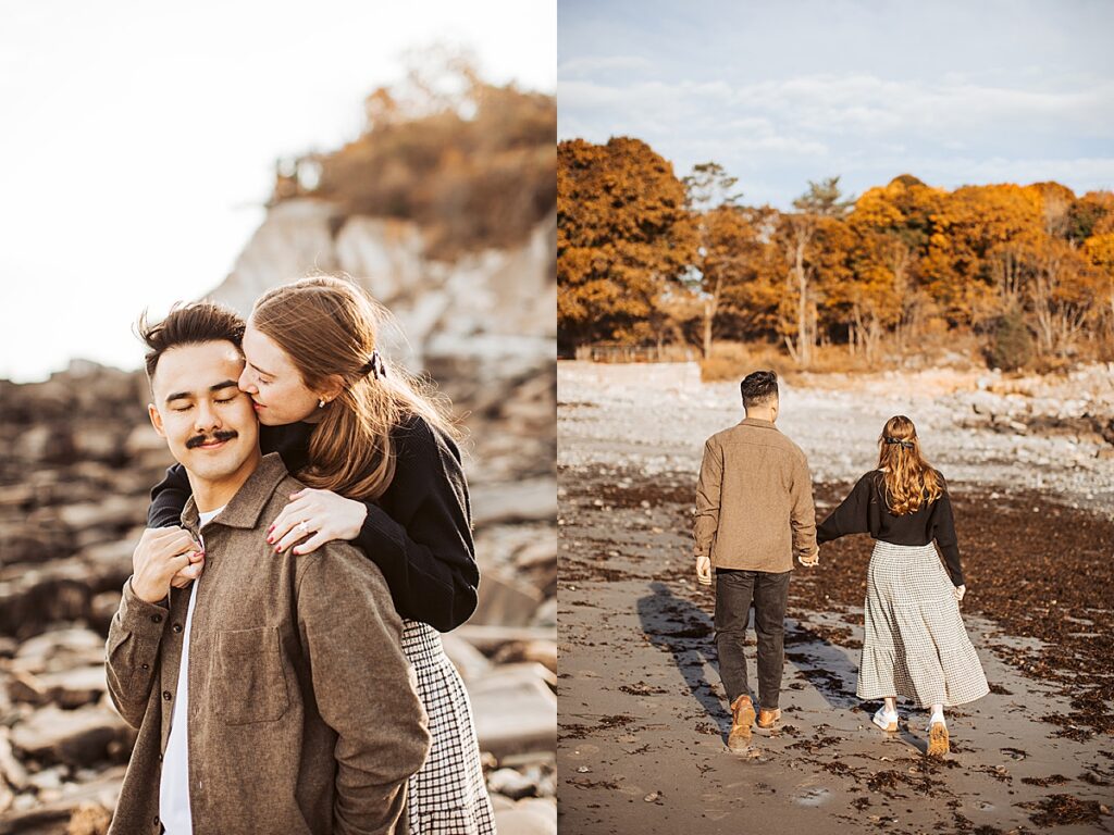 Woman kisses partner’s cheek while standing on rocks, then the couple walks hand in hand along seaweed-covered beach.