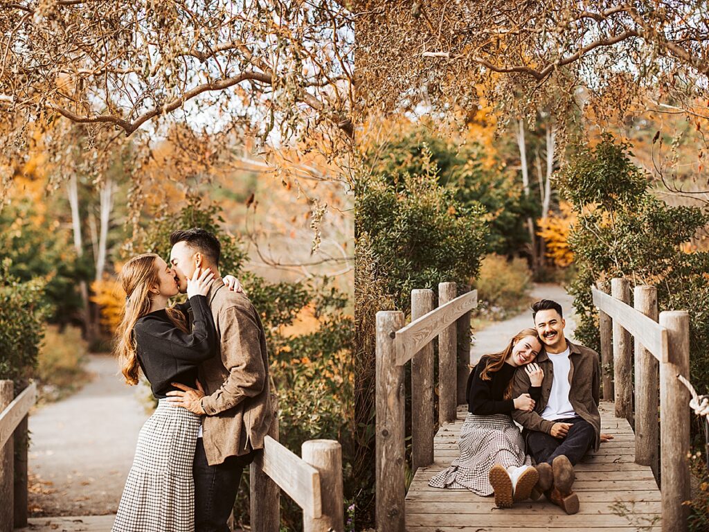 Couple kissing on wooden bridge and sitting together on the walkway surrounded by autumn leaves and greenery.