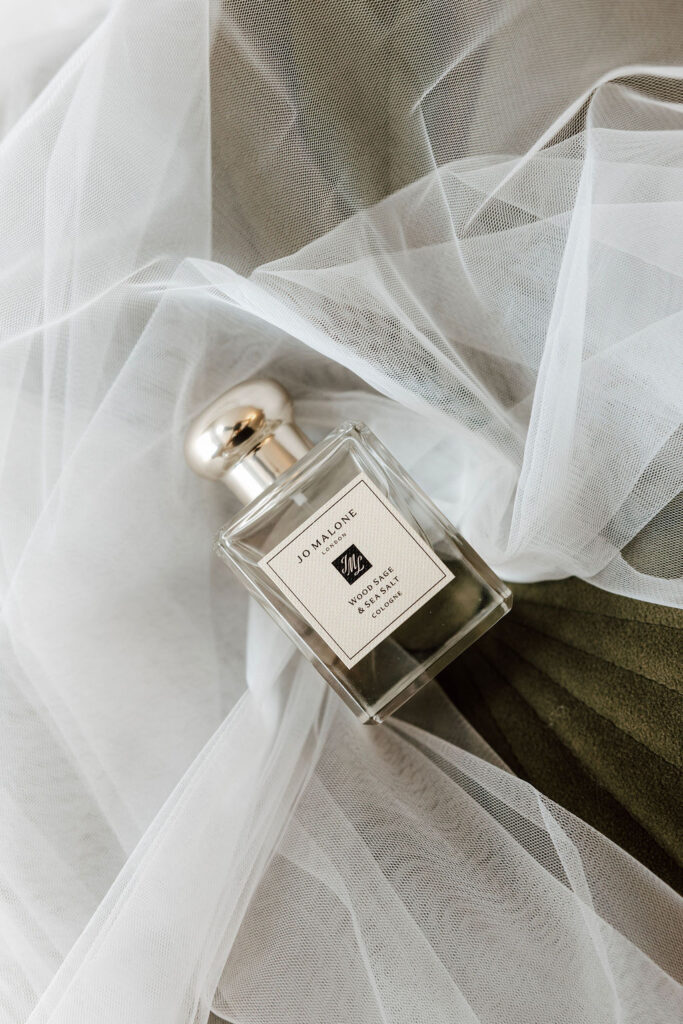 Jo Malone Wood Sage & Sea Salt perfume on soft tulle fabric, bridal getting ready detail